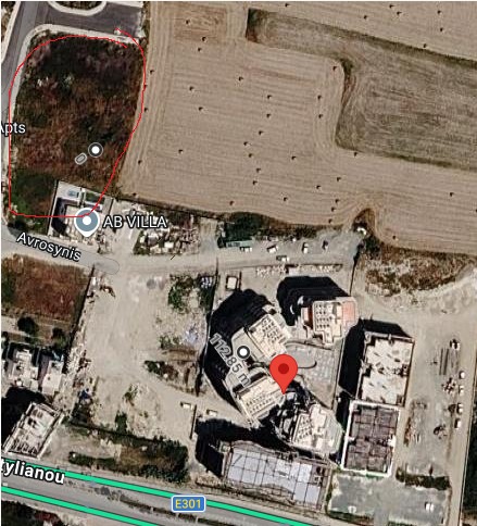 Satellite map with the empty plot for possible additional parking circled in red
